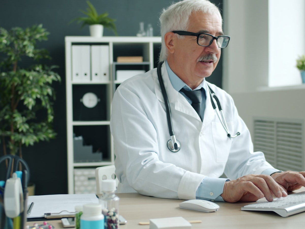 Doctor working at a computer in a modern office